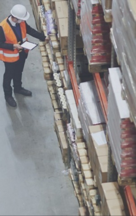 Two workers in a logistics facility